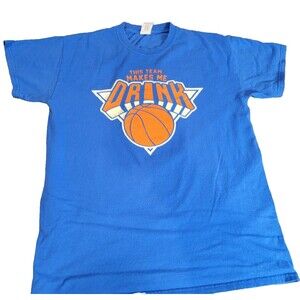 NBA blue New York Knicks Graphic that reads "This Team Makes Me Drink". Medium